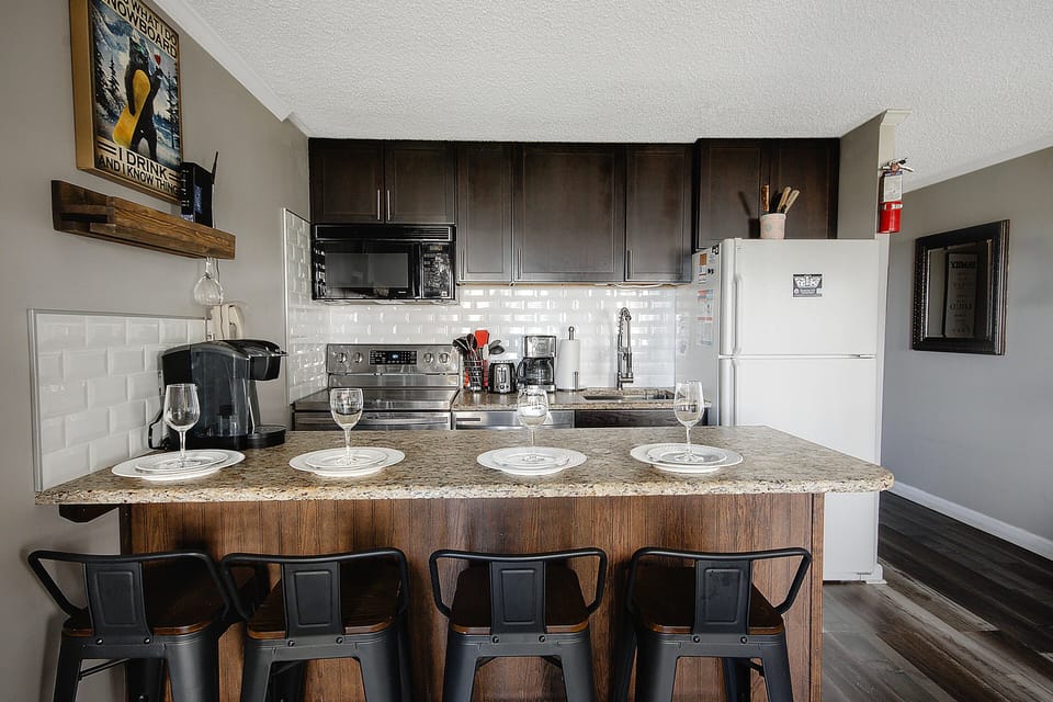 The kitchen is fully equipped, allowing you to prepare and enjoy meals right in the comfort of the property.