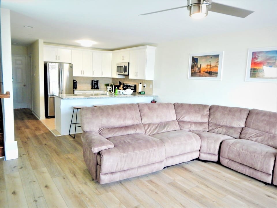 Main floor. Open concept with sectional couch with counter seats