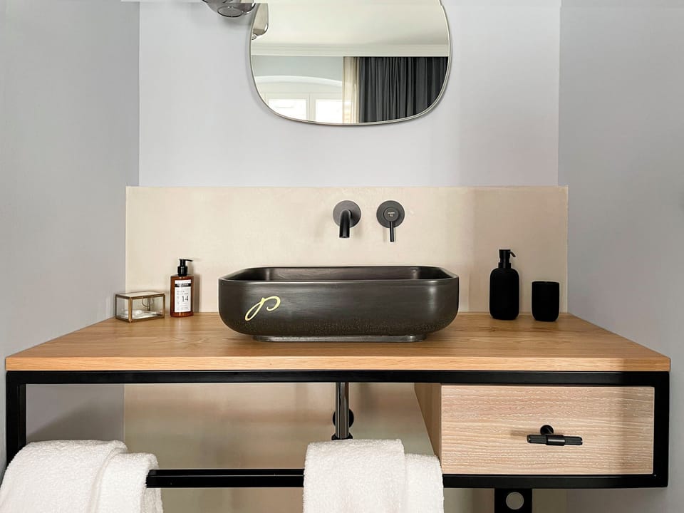 Shower, rainfall showerhead, eco-friendly toiletries, towels