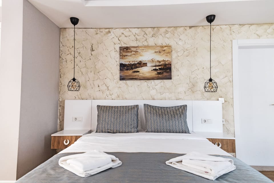 Superior Quadruple Room, Terrace | Minibar, individually decorated, individually furnished, desk