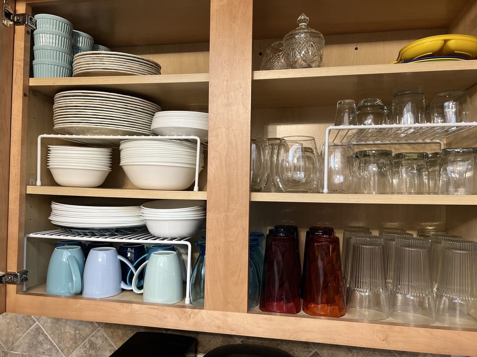 2023 Stocked Cupboard - Wine Glasses and Pint glasses in Dining Room Hutch