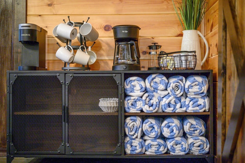 Coffee bar with a starter set of pods, a French press, and a traditional drip coffee maker. Plenty of hot tub towels, too!!