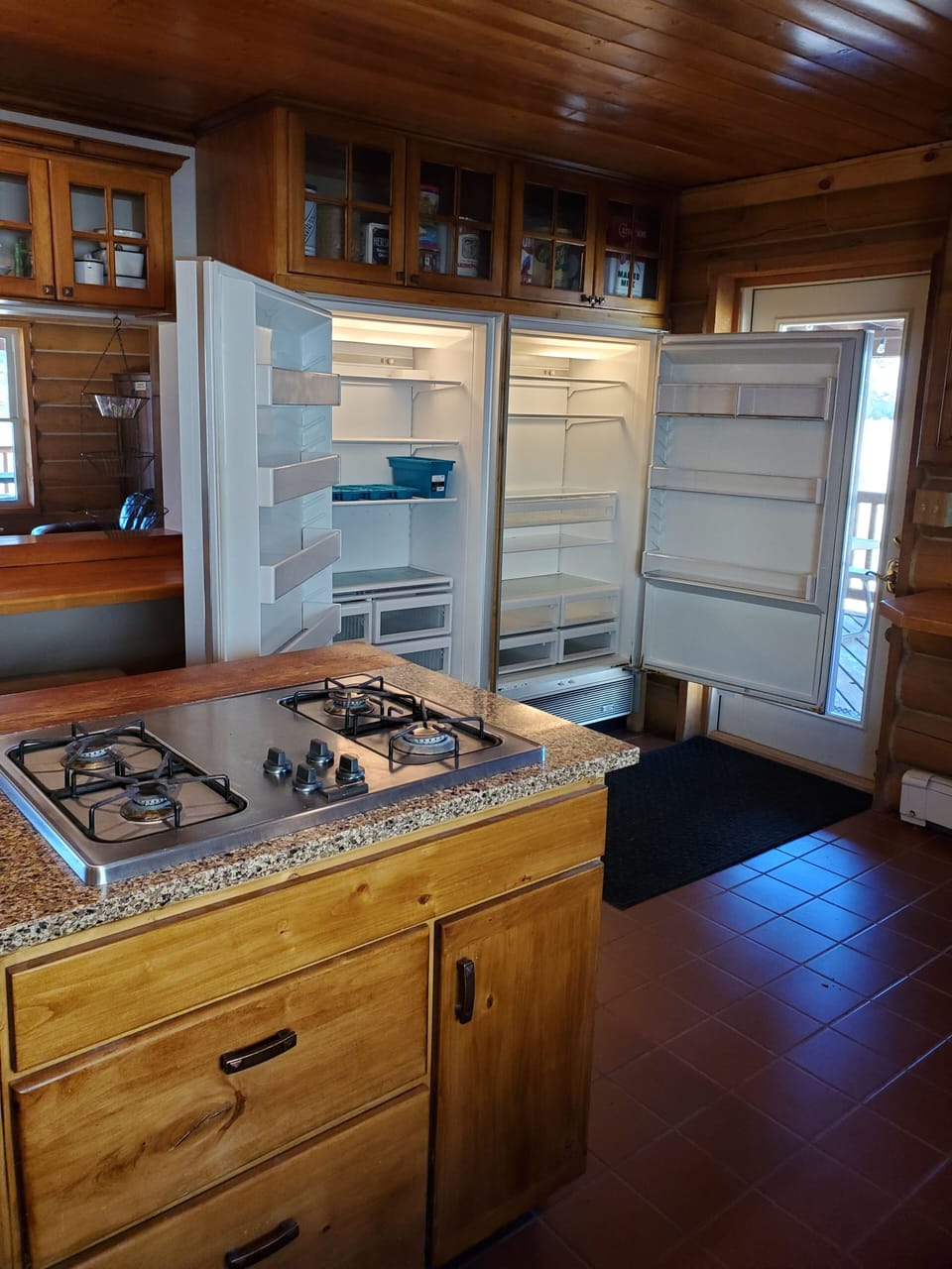 Commercial size refrigerator and freezer in kitchen