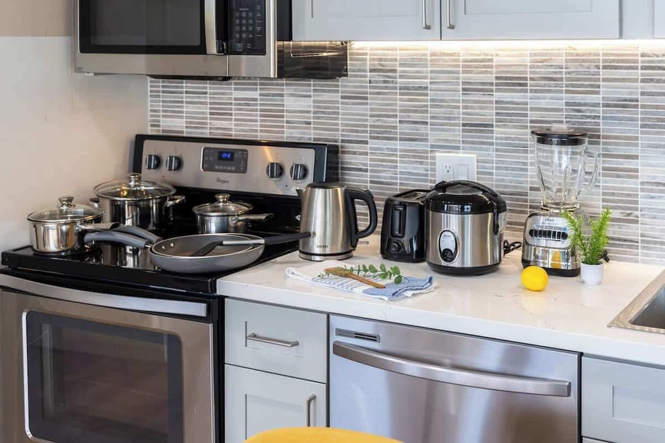 Modern kitchen with stainless steel appliances and a tiled backsplash