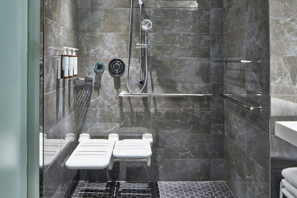 Shower, rainfall showerhead, designer toiletries, hair dryer