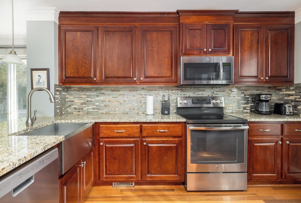 Bright Kitchen with ample counter space and stainless steel appliances