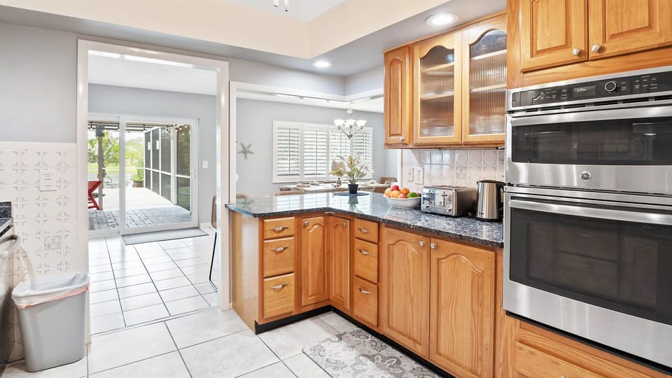 Cook, dine, and connect in this well-appointed kitchen featuring bar stools and all the appliances you need for a comfortable stay.