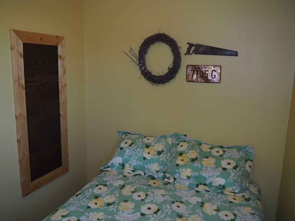 BEDROOM:  Features a full-size bed.