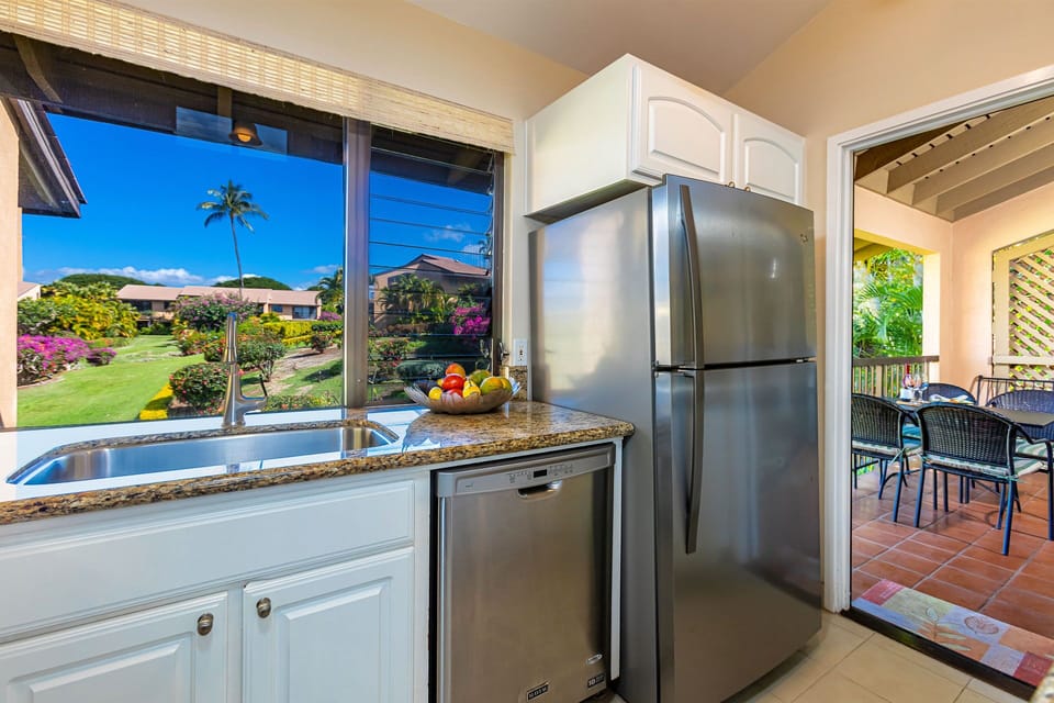 The kitchen has a door leading out to the lanai.