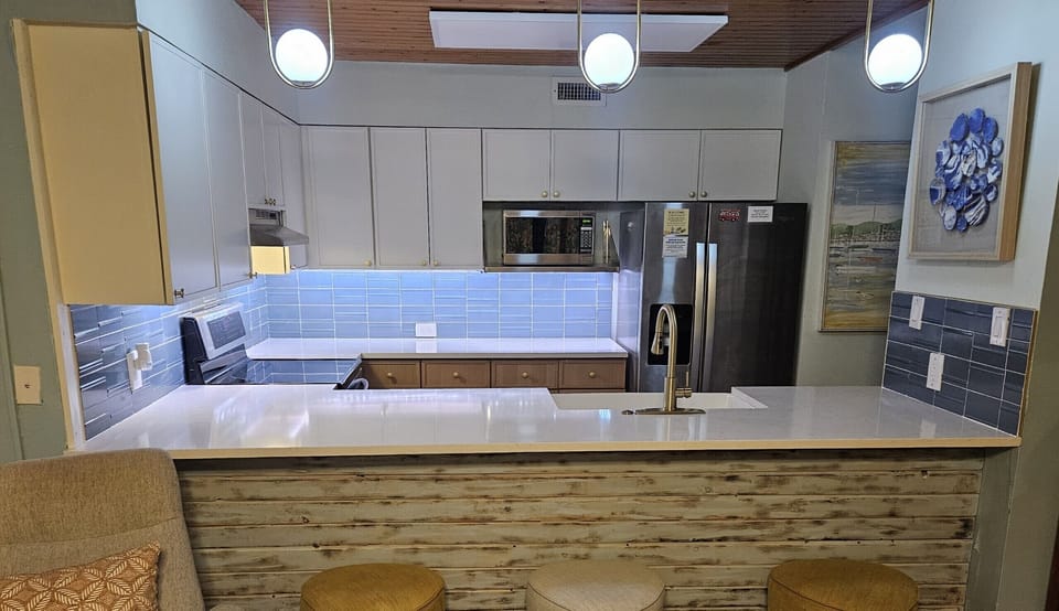 Newly remodeled kitchen has plentiful cabinets and counterspace
