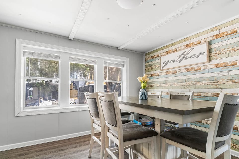 Sunlit dining area with rustic charm and cozy seating