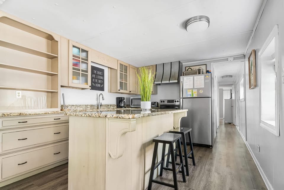 Bright, modern kitchen with spacious breakfast bar seating