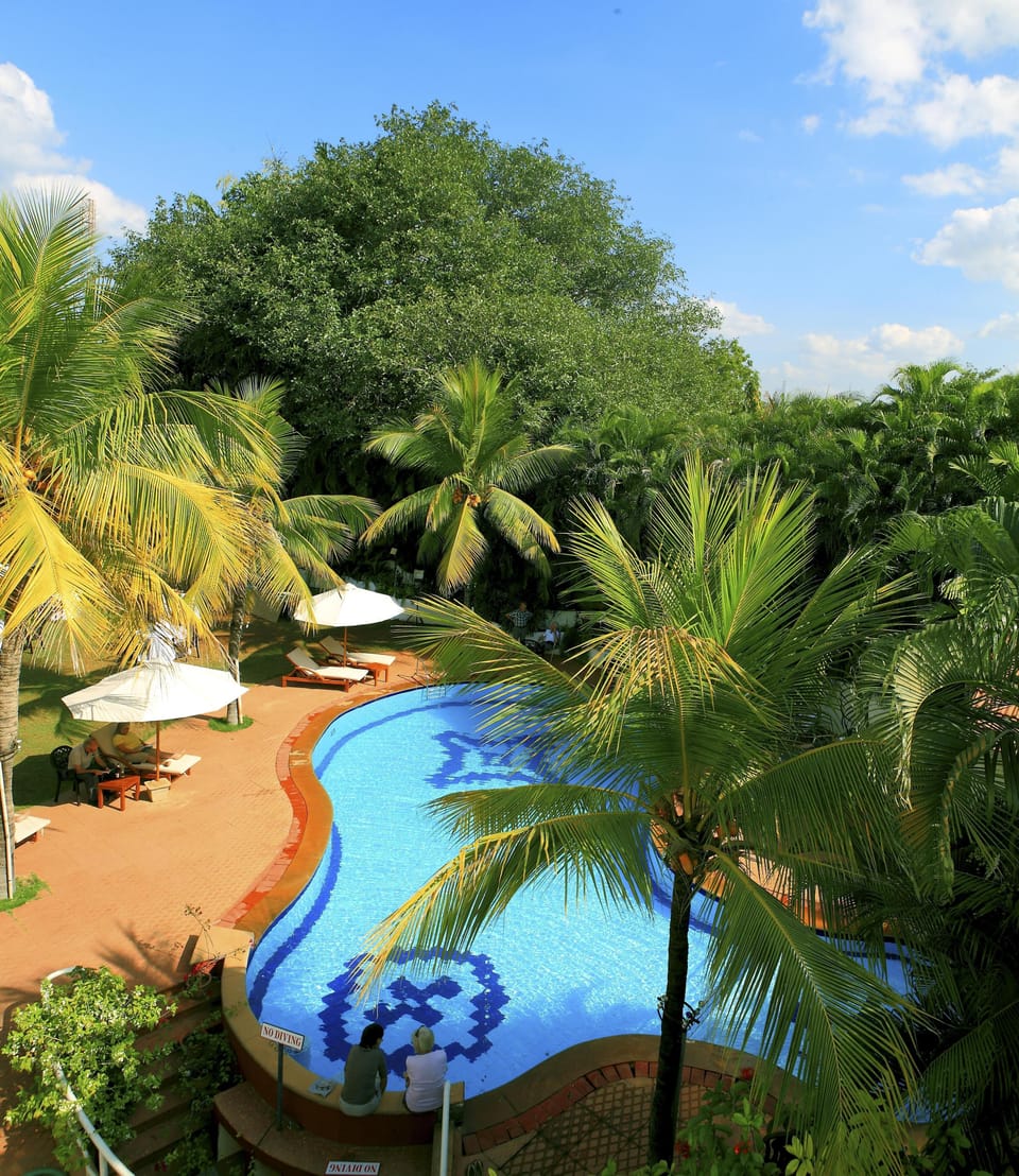 Outdoor pool, pool umbrellas, sun loungers