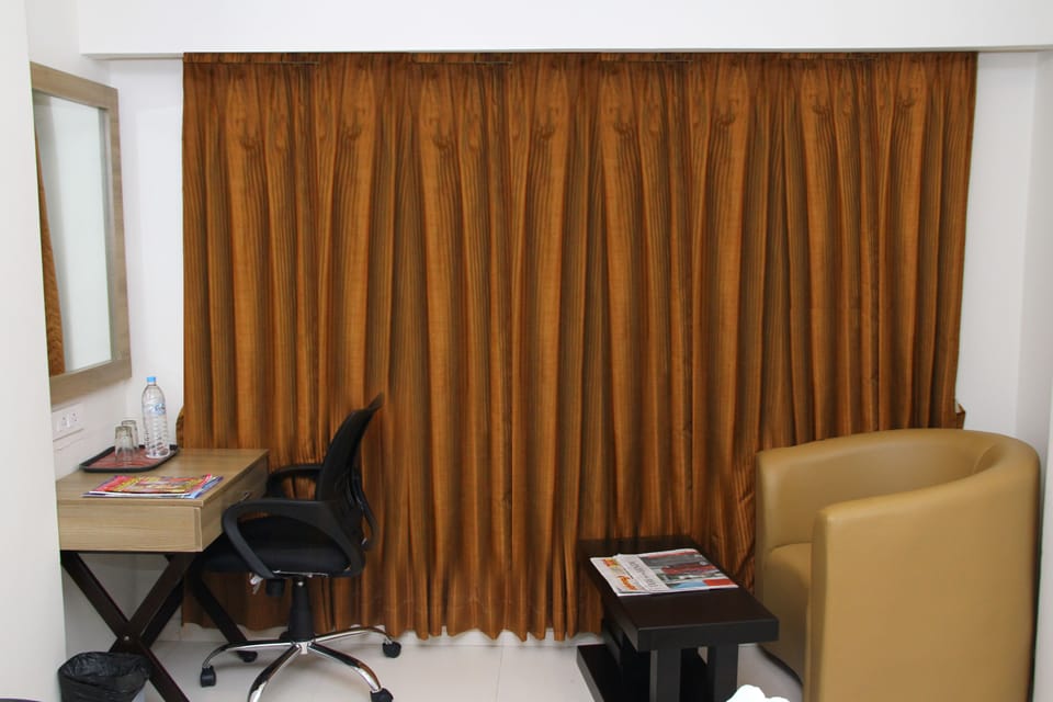 Vinayaga Family | In-room safe, desk, soundproofing, bed sheets