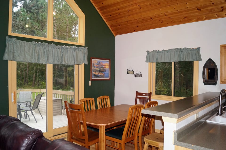 The kitchen counter has 6 stools for additional seating.