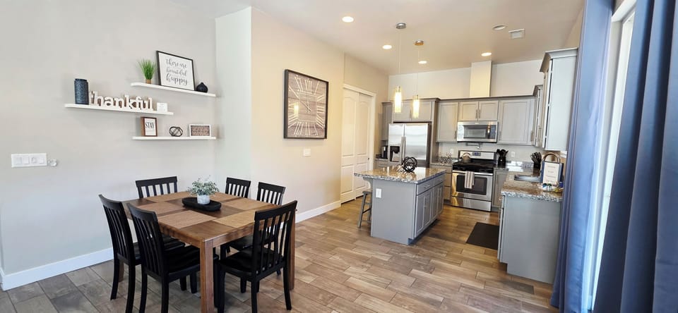 Bright open-concept kitchen and dining area with modern mountain charm.