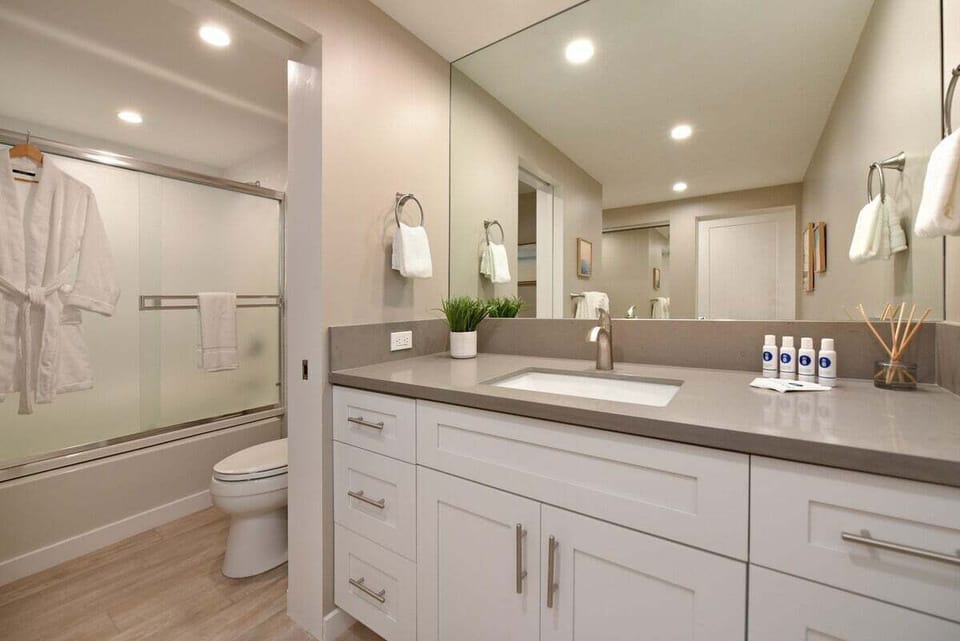 Freshen up in a bright bathroom with a spacious vanity and modern shower