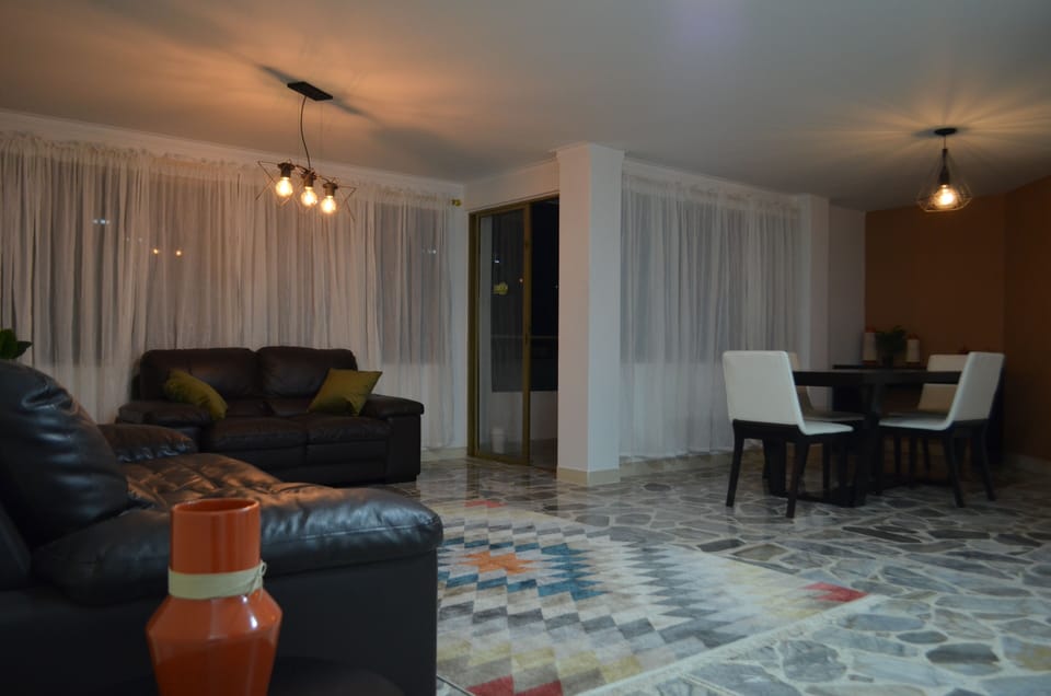 Exclusive Triple Room | Living area | Flat-screen TV