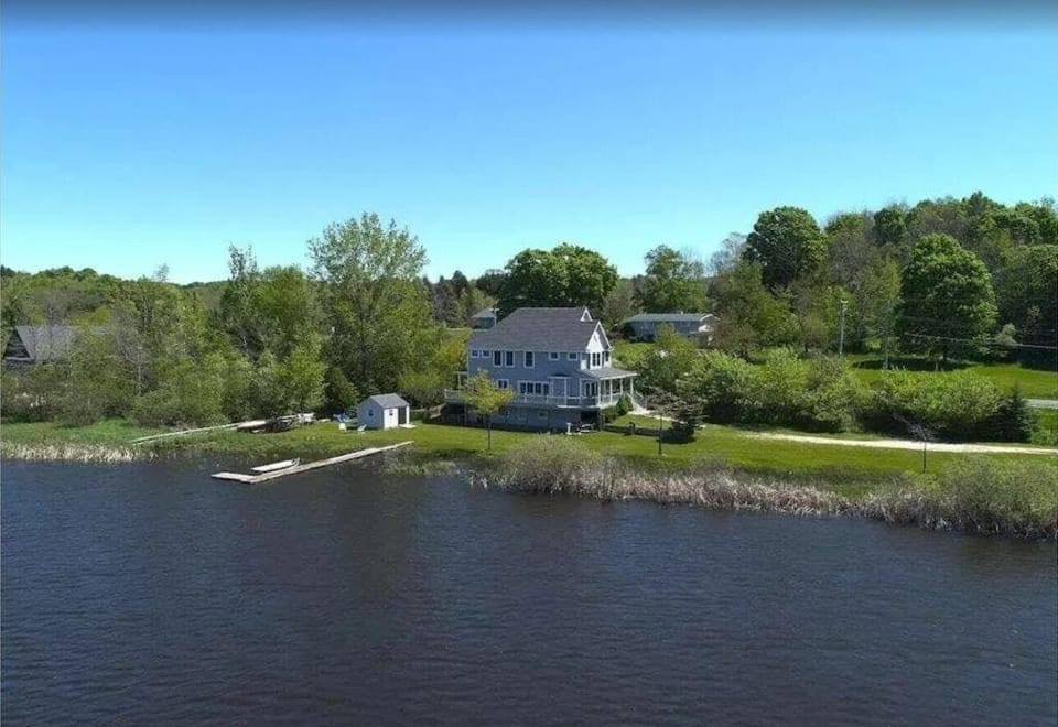 EXTERIOR:  A great aerial photo of the house from up above Betsie Lake.