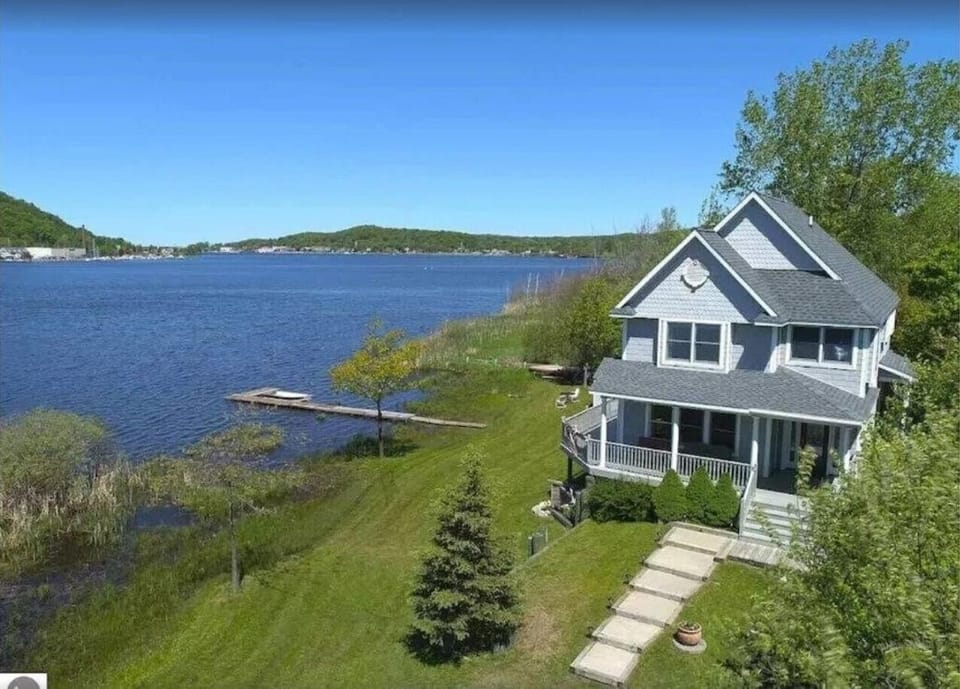 OVERALL:  A nice aerial view of the house with Betsie Lake right next to the house and downtown Frankfort and Lake Michigan in the distance.