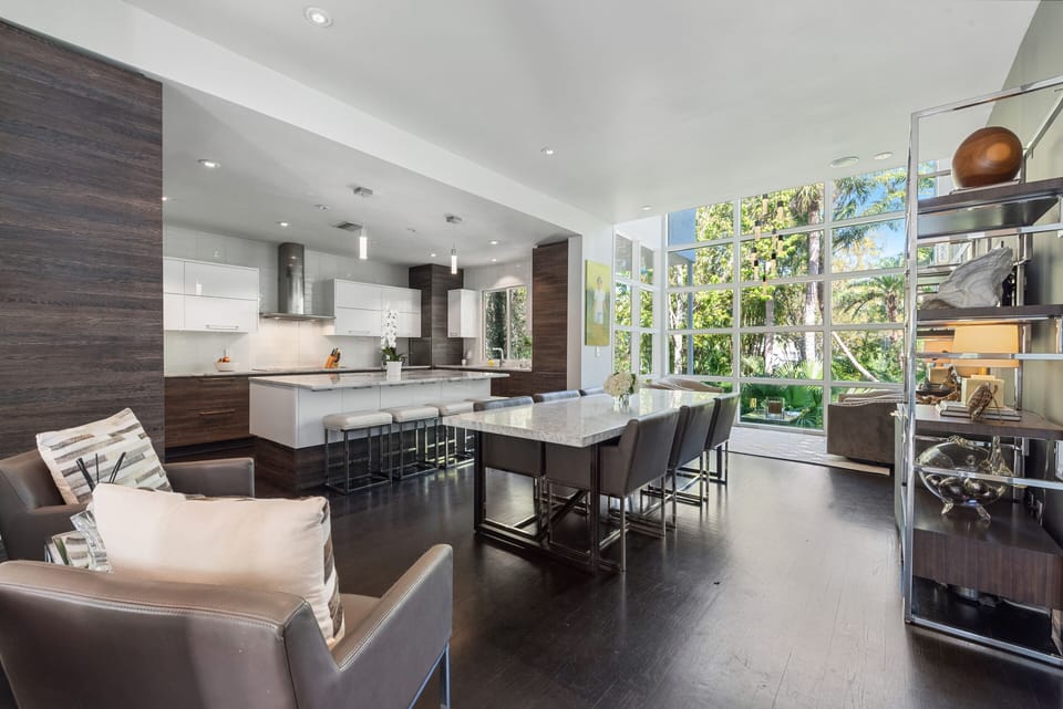 Dining/kitchen area: 8 person RH marble dining table + 8 additional seating area