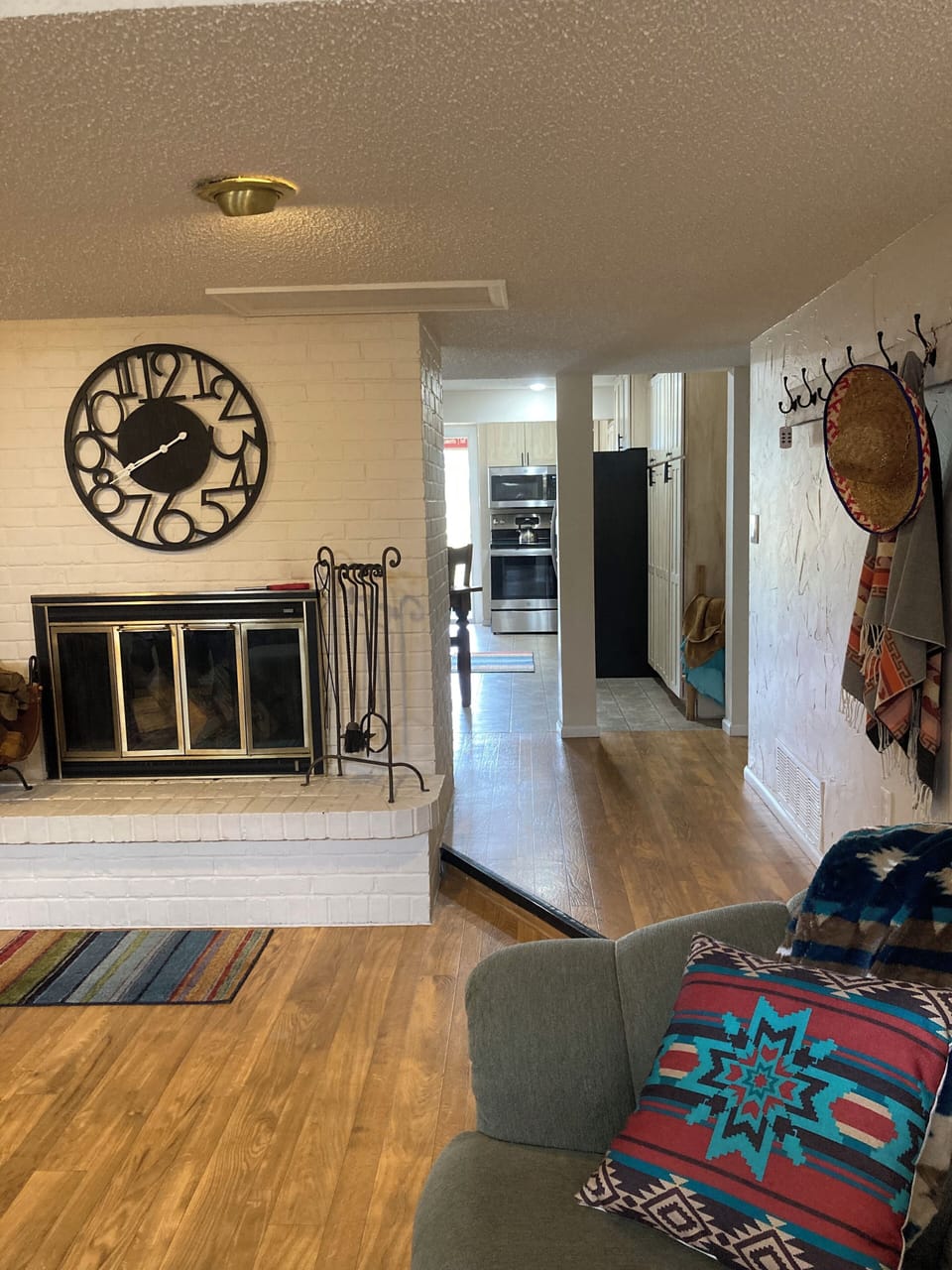 Looking from the living room into the kitchen, there is a 4” step down.