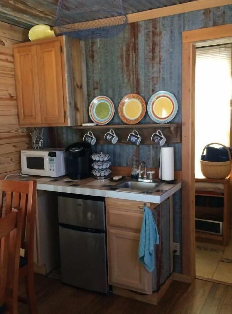 Microwave, Keurig coffee maker, and frig with freezer