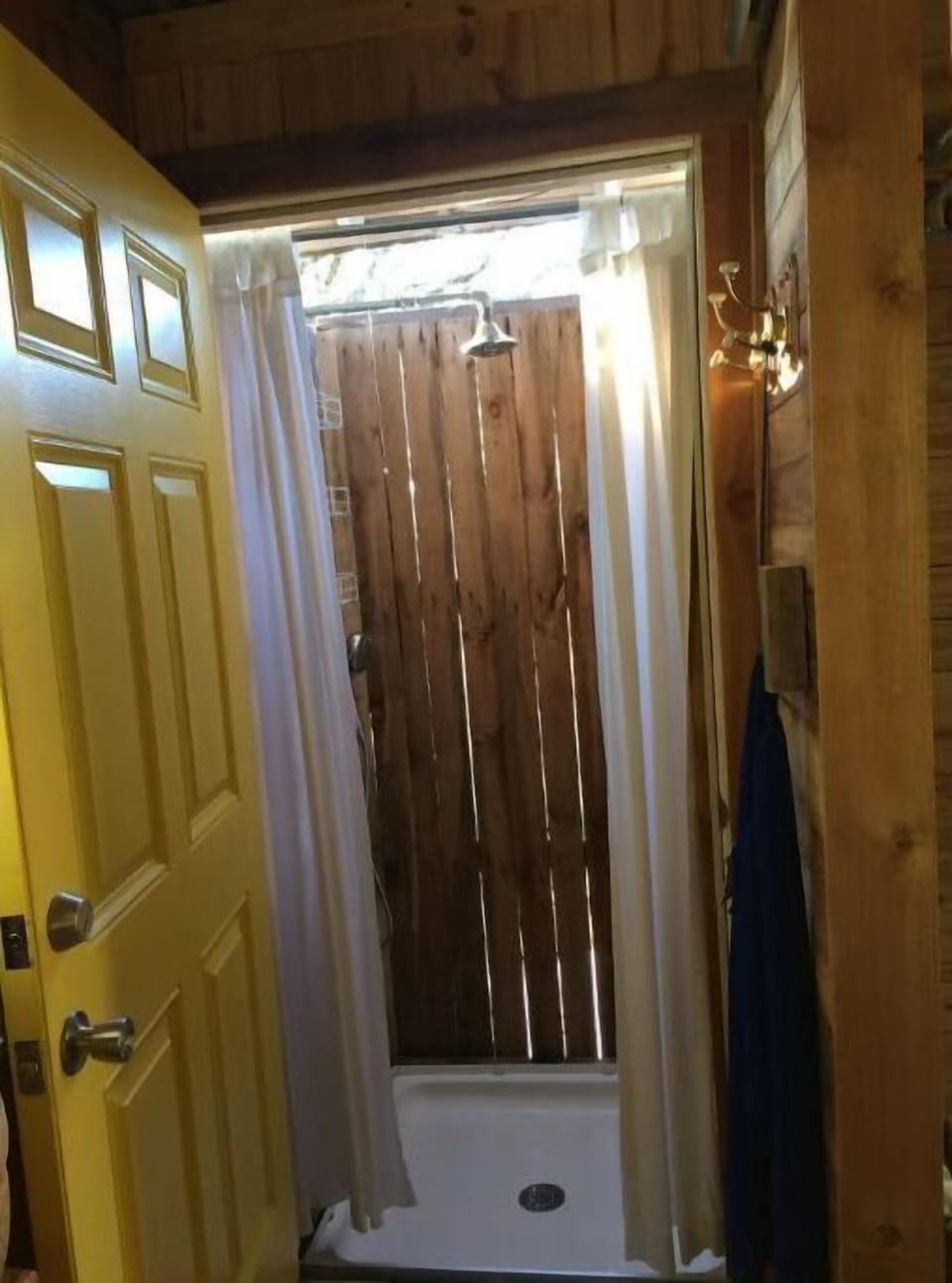 Outdoor shower just step into from the private bathroom