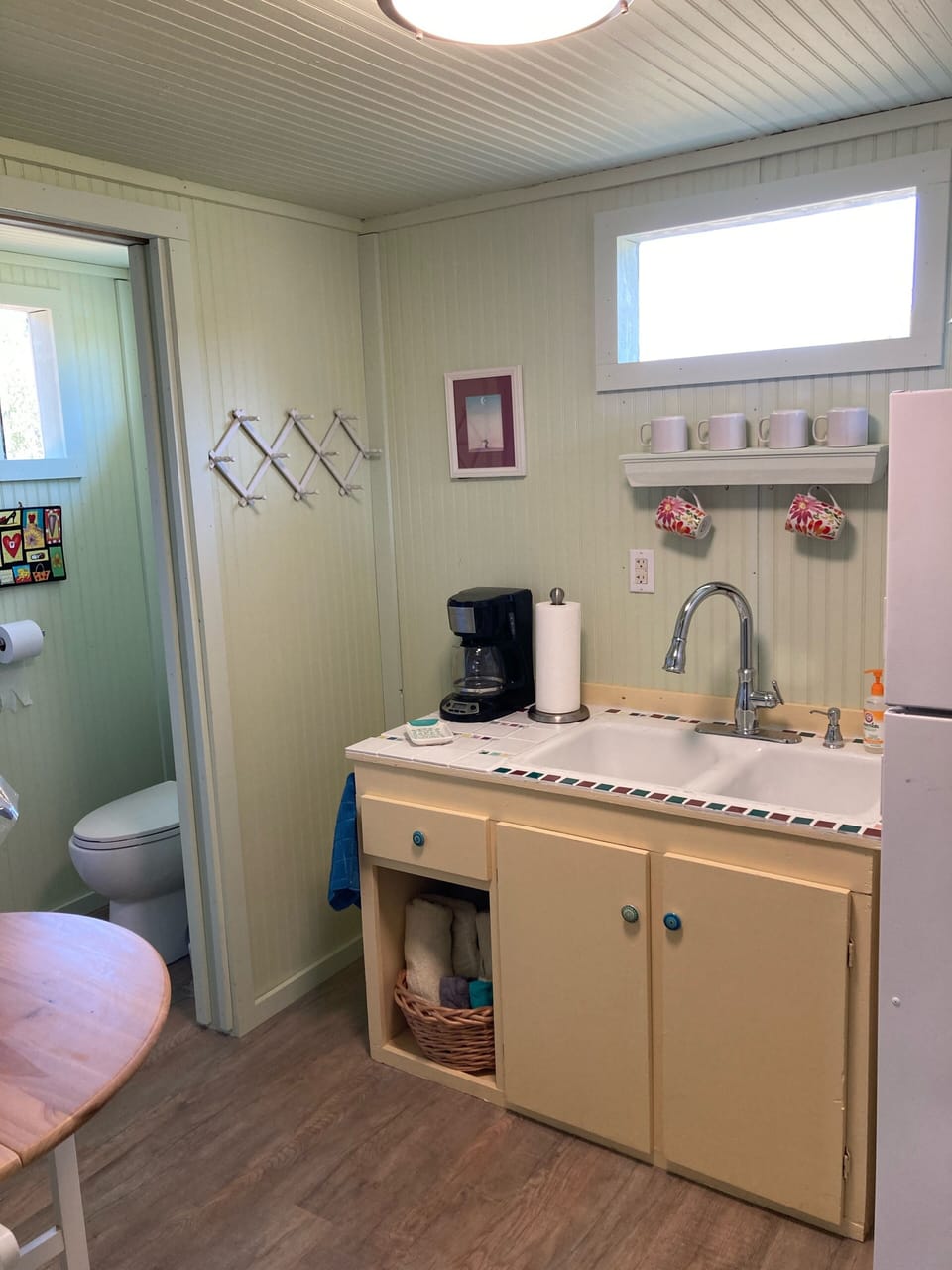 Kitchenette with dishes, etc., microwave, coffee maker, and full size frig