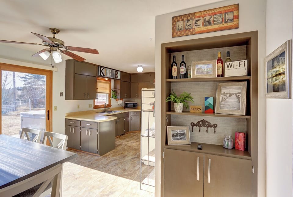 Fully equipped kitchen w/ dark cabinets, microwave & happy vibes only!