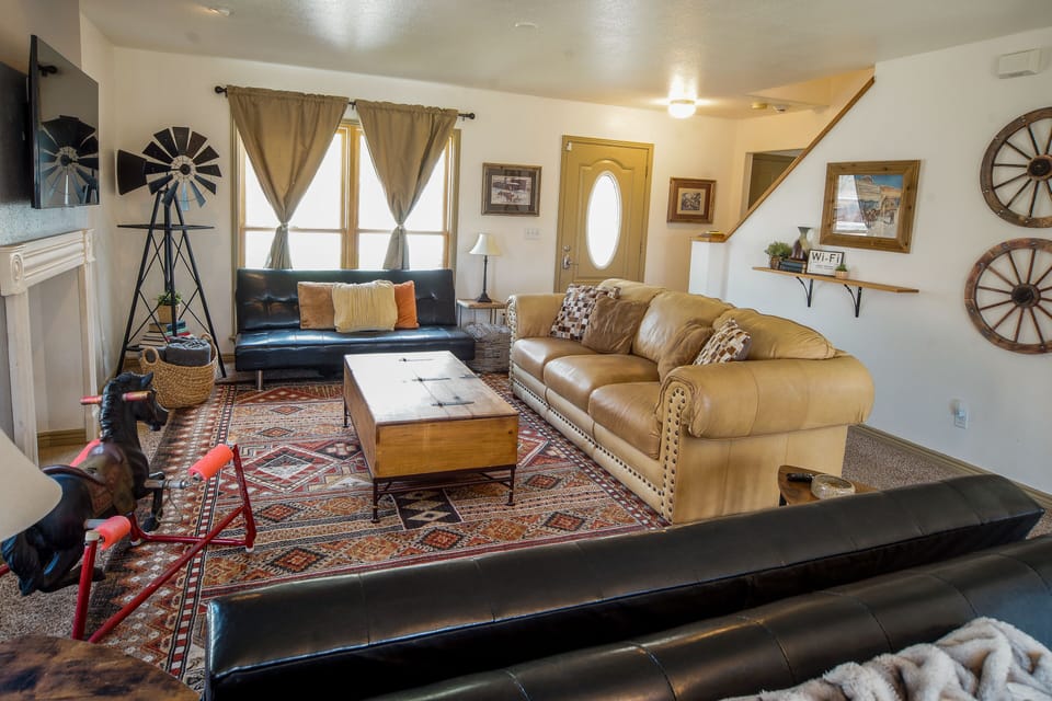 Spacious living room with queen sofa bed and 3 twin futons. Games & puzzles too!