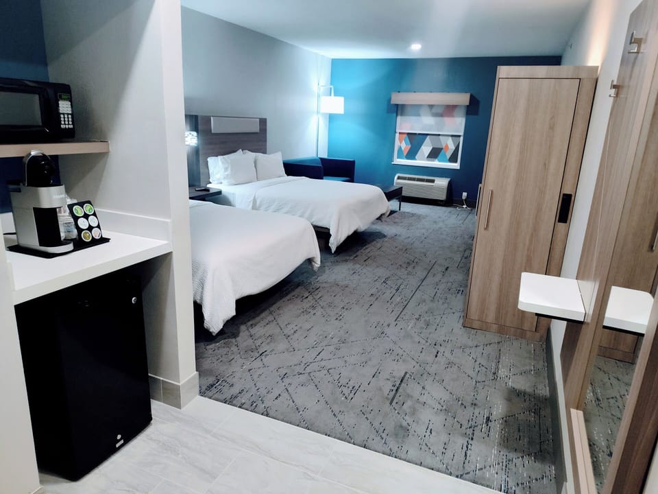 Suite, 2 Queen Beds | Desk, blackout drapes, iron/ironing board, free WiFi