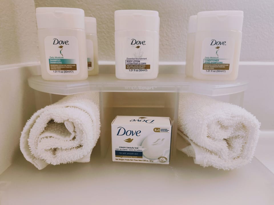 Suite, 2 Queen Beds | Bathroom | Combined shower/tub, rainfall showerhead, hair dryer, towels
