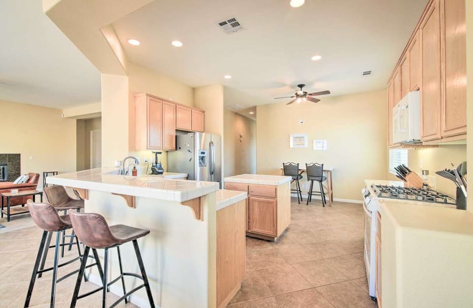 Kitchen, breakfast bar, and work-station desk in the nook. 