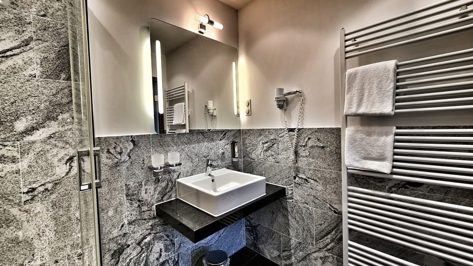 Standard Double Room | Bathroom | Eco-friendly toiletries, hair dryer, slippers, towels