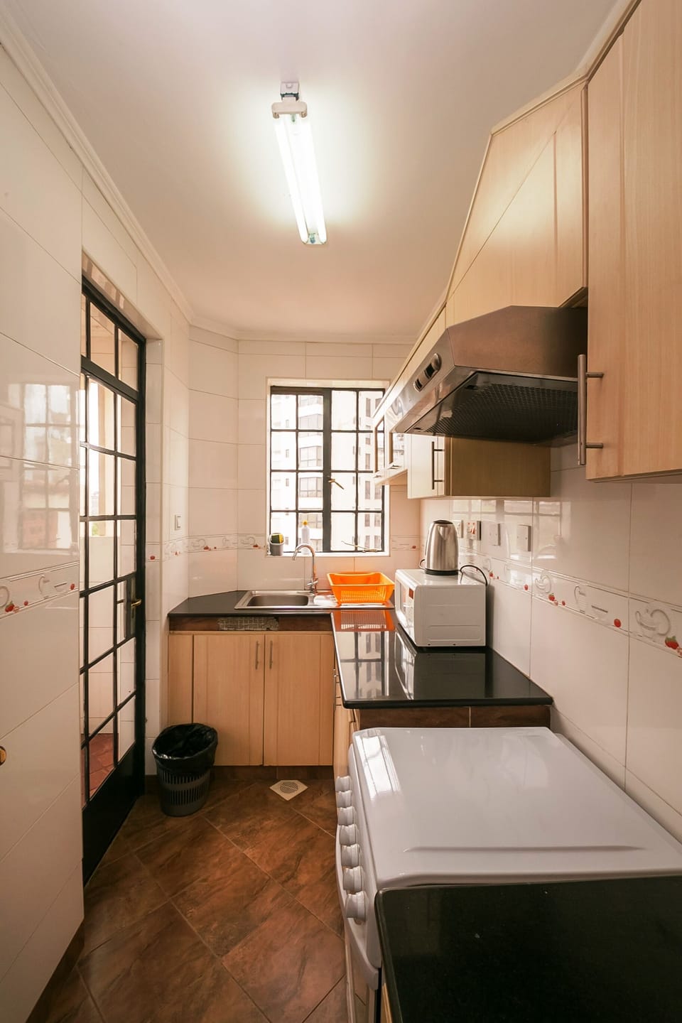 Full-size fridge, microwave, stovetop, cookware/dishes/utensils
