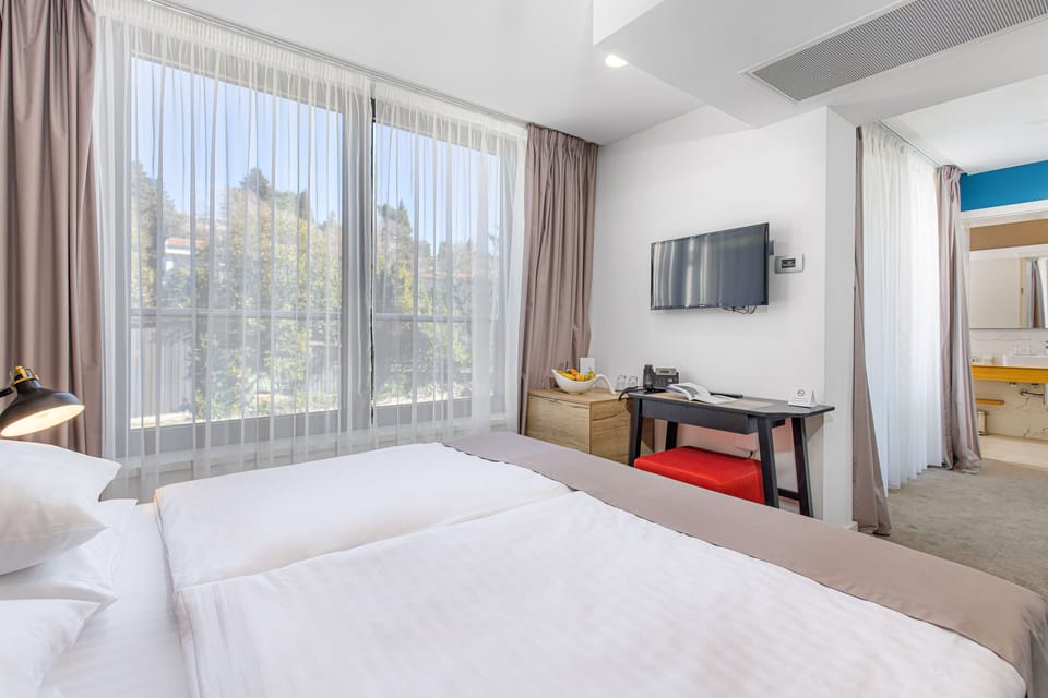 Classic Double or Twin Room, Balcony | Minibar, in-room safe, desk, blackout drapes