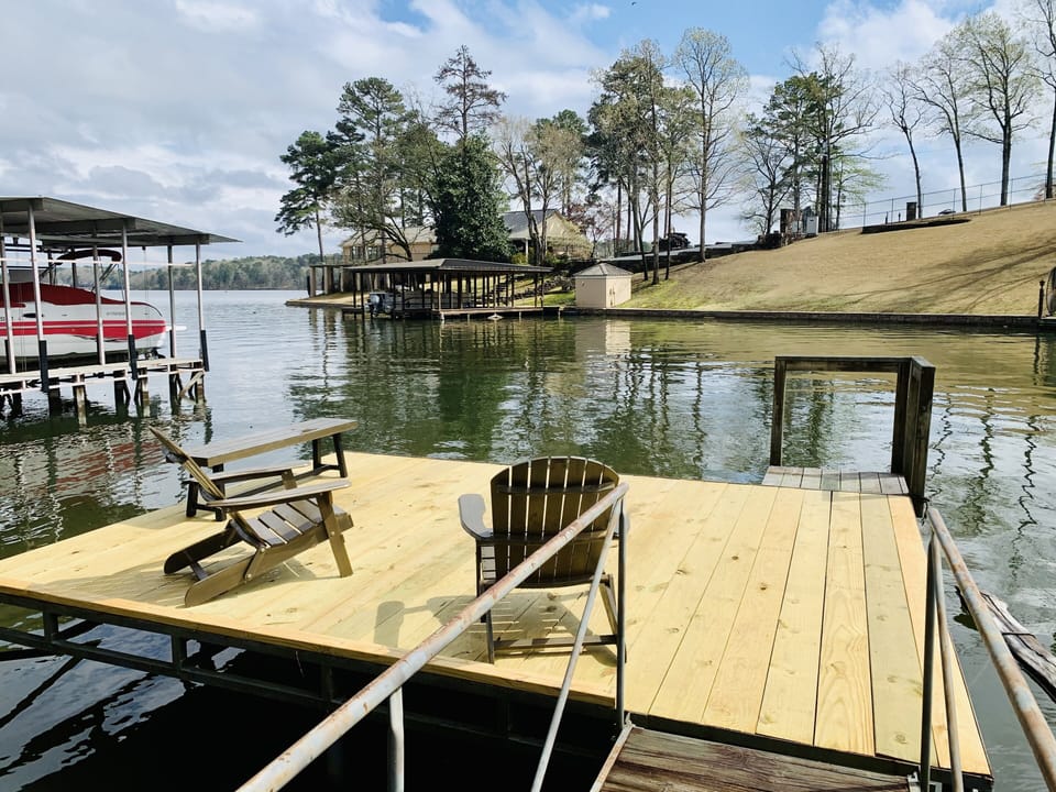 Swim dock w/ two chairs & bench leaving space to lay out / play.