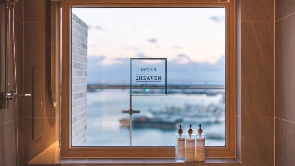 Ocean View Balcony Queen Room | Bathroom | Combined shower/tub, hair dryer, bathrobes, slippers