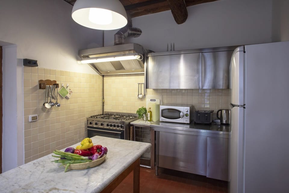Lighting, Room, Interior Design, Ceiling, Light Fixture, Countertop, Interior Design, Kitchen Stove, Kitchen, Major Appliance