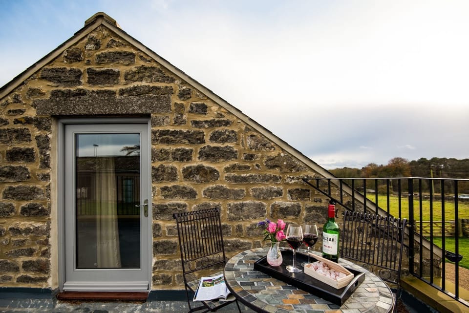 The Granary at Rothley East Shield - roof terrace with cafÃ© table and chairs to enjoy open countryside
