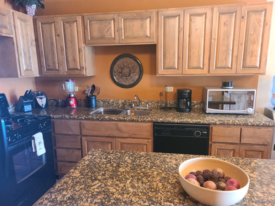 Updated appliances granite counter tops. Plenty of room to prepare family meals