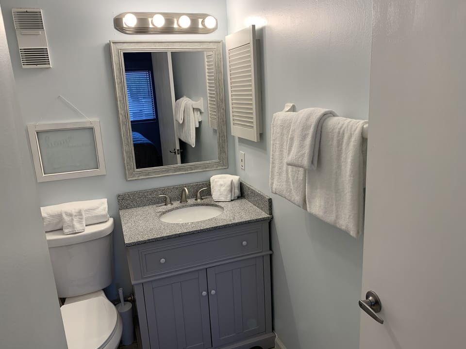 Updated Main Bath with granite countertop.