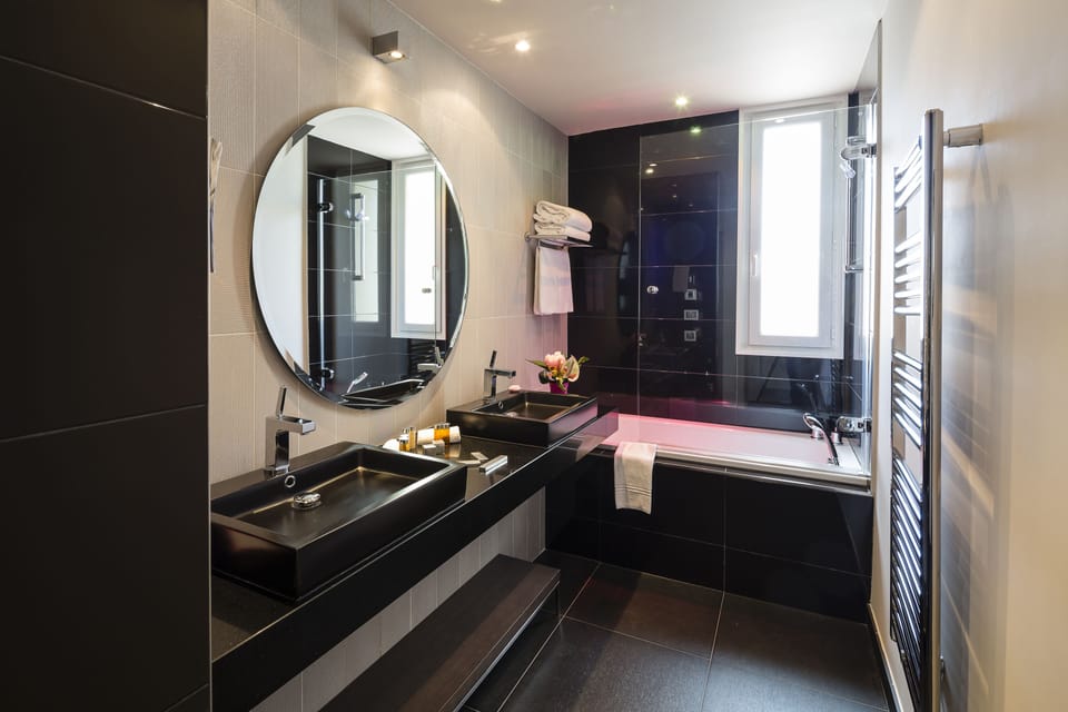 Suite | Bathroom | Designer toiletries, hair dryer, bathrobes, slippers