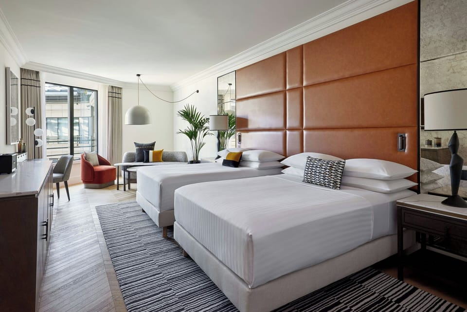 Premium bedding, down comforters, pillowtop beds, minibar
