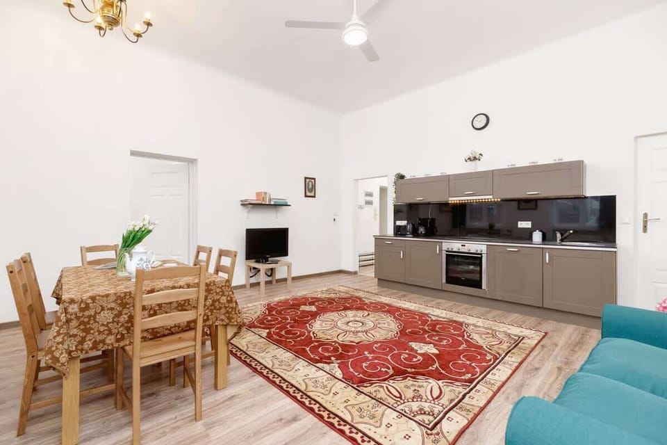 Kitchenette with oven and refrigerator. 