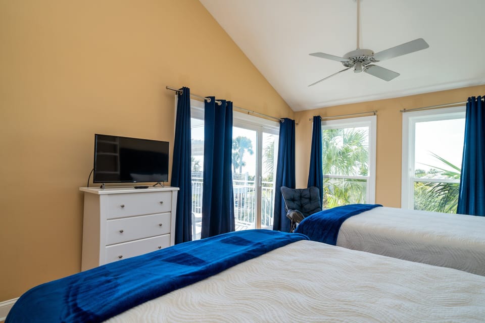 Sliding door to the deck with chaise lounge chairs to relax and 
enjoy the view.