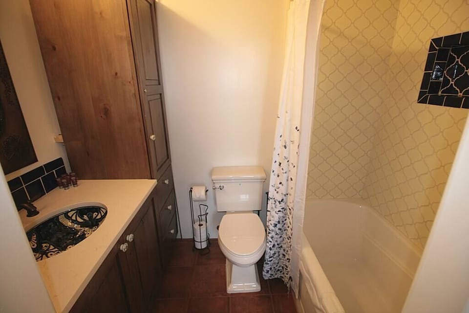 Wash your troubles away in the cozy bathtub with a shower