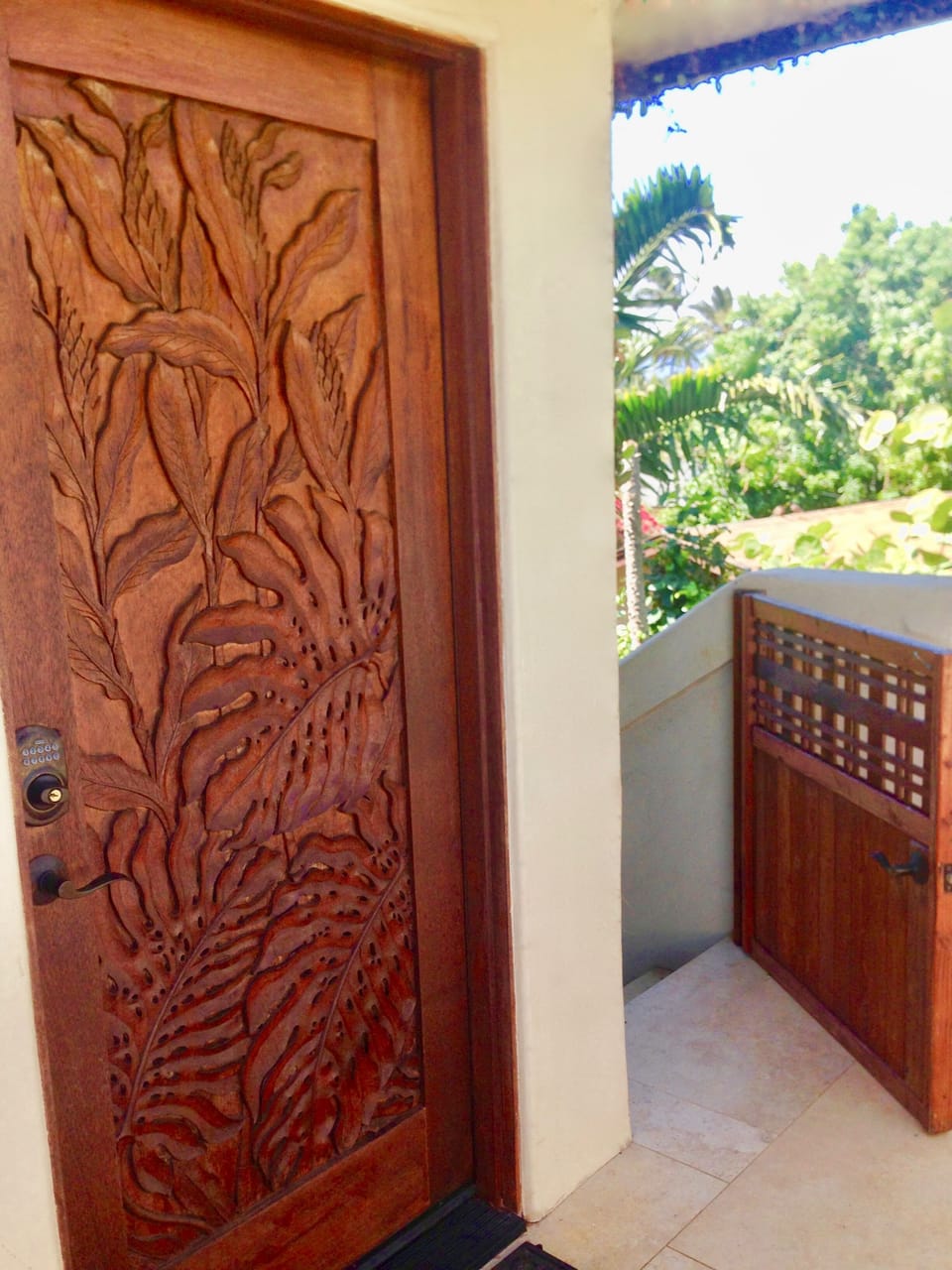 Access to the cottage is up a private staircase and hand carved front door.