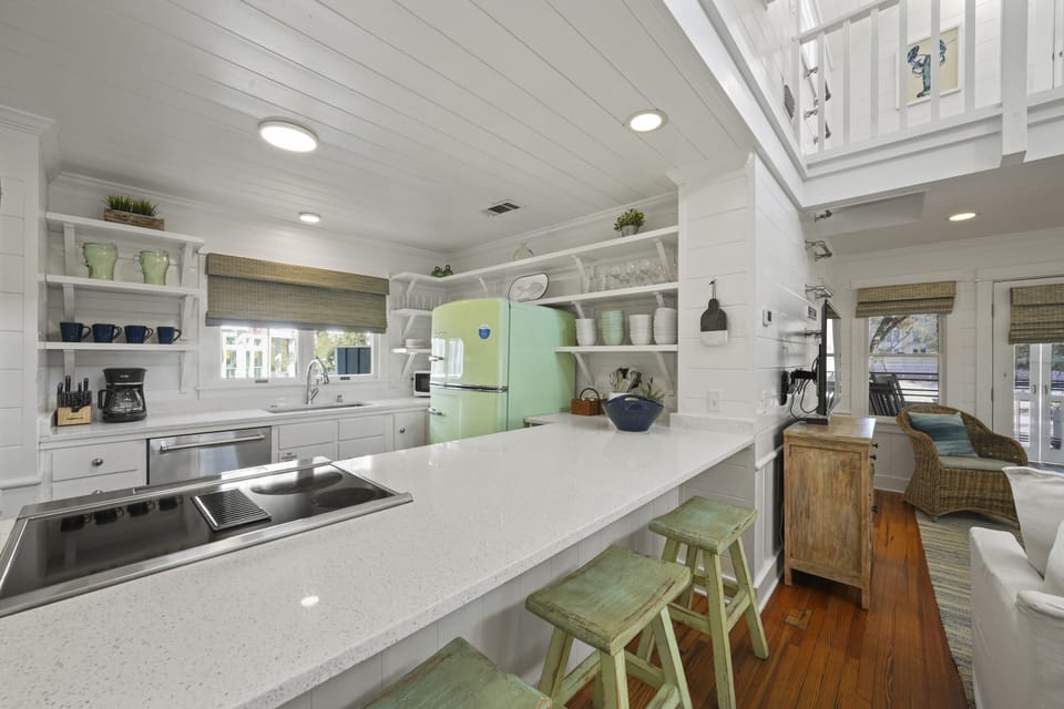 RENOVATED KITCHEN W/BAR SEATING FOR THREE